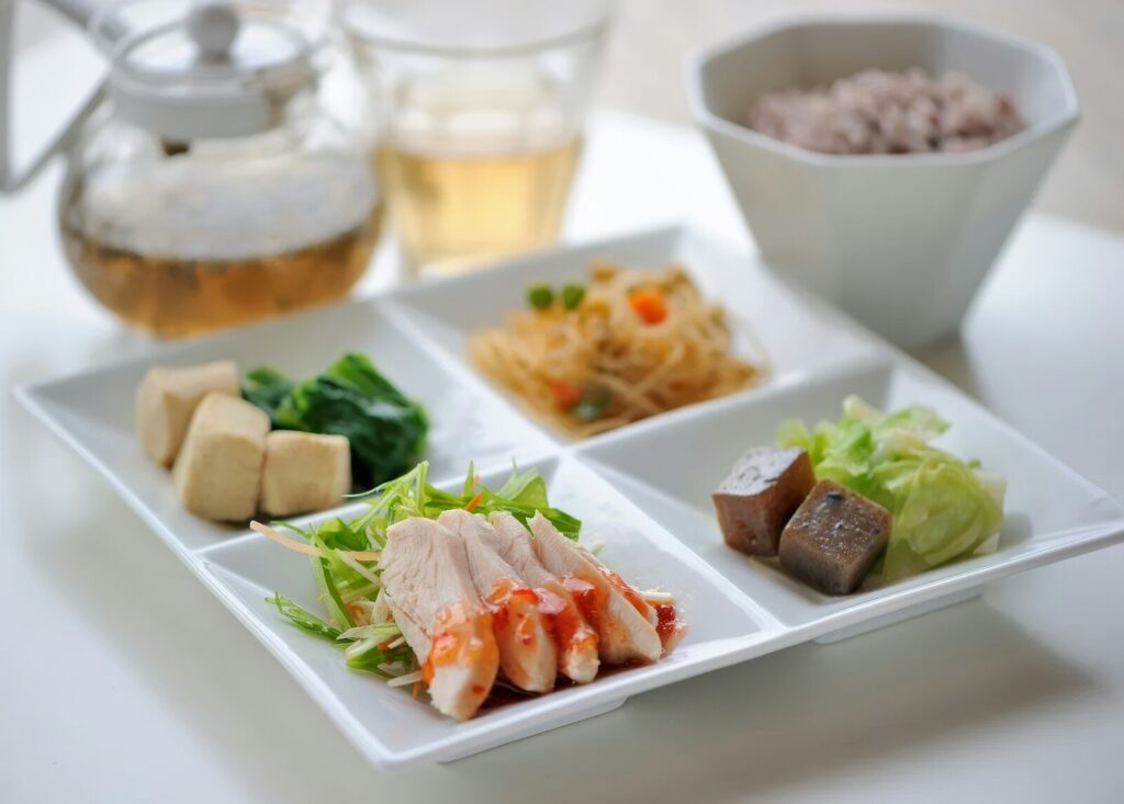 A white plate topped with different types of food