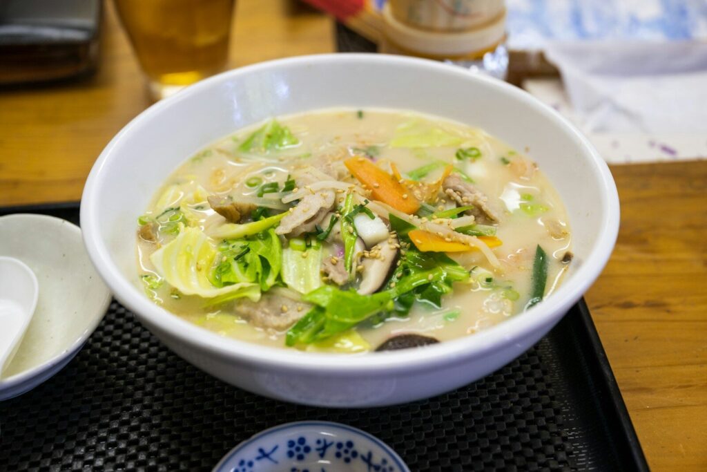 a bowl of soup is sitting on a tray