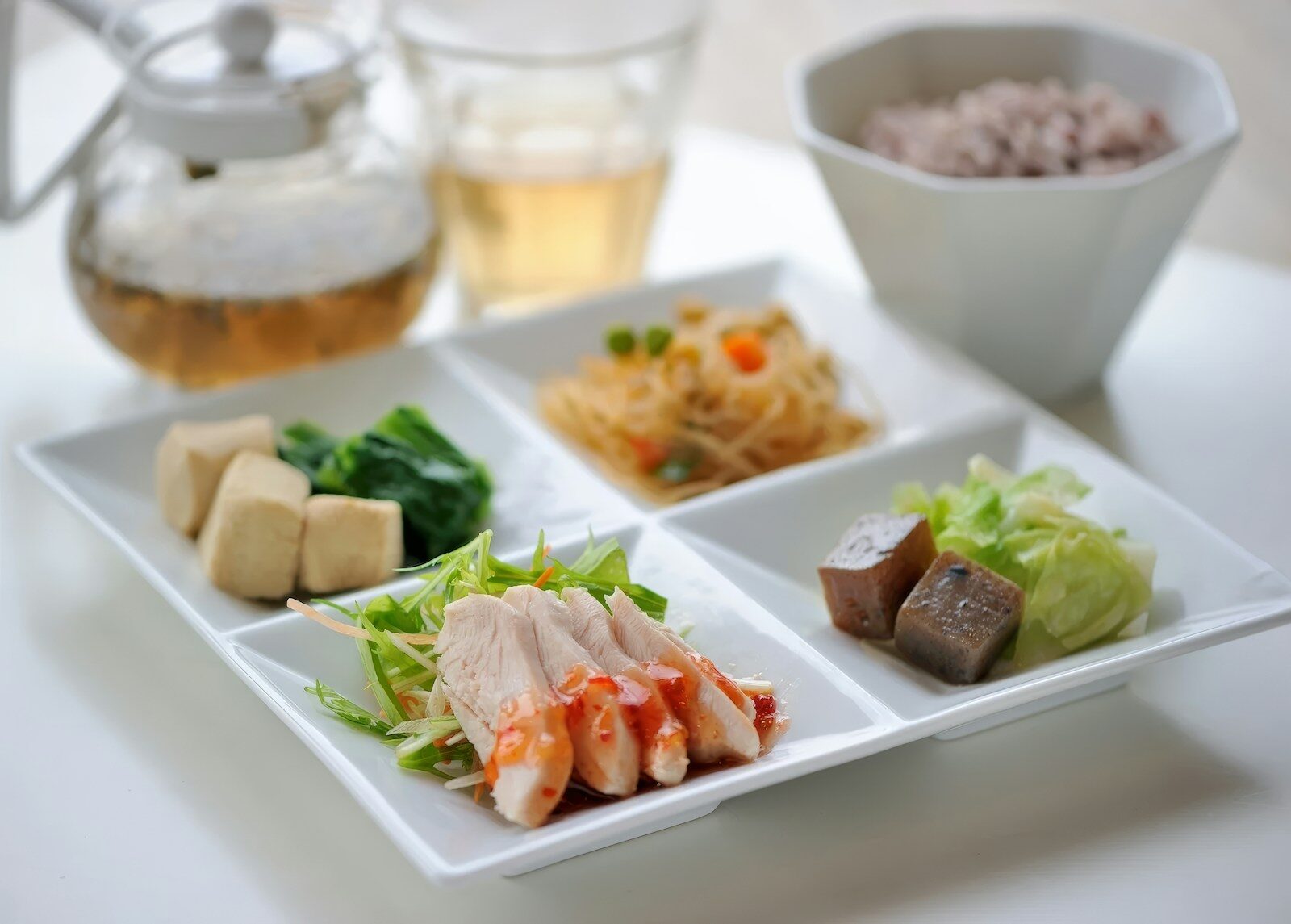 A white plate topped with different types of food