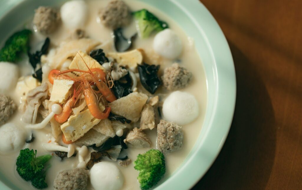 cooked shrimp with sauce on white ceramic plate