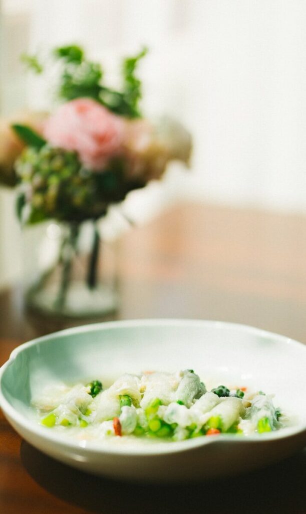 green vegetable on white ceramic bowl