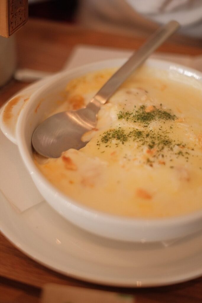 a bowl of soup with a spoon in it