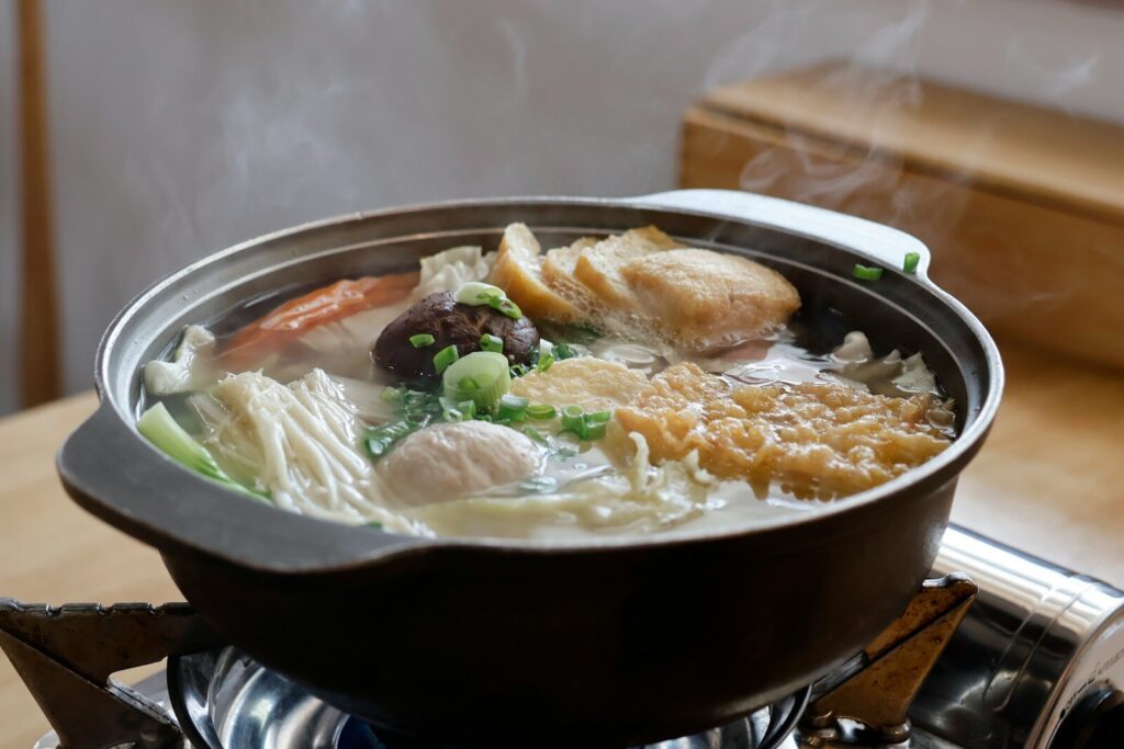 a pot of soup on top of a stove